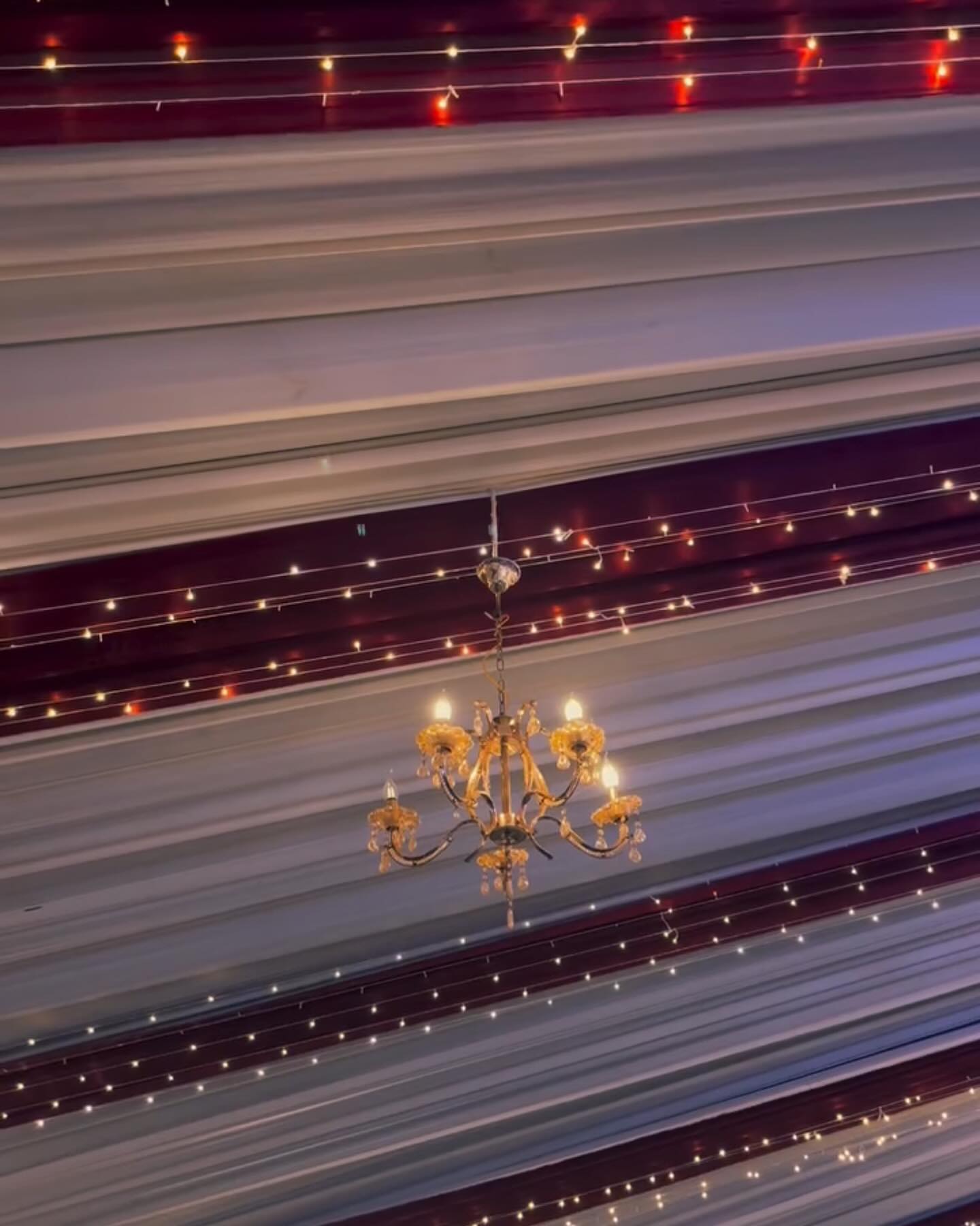 Artisanal Chandelier & Fabric Detailing